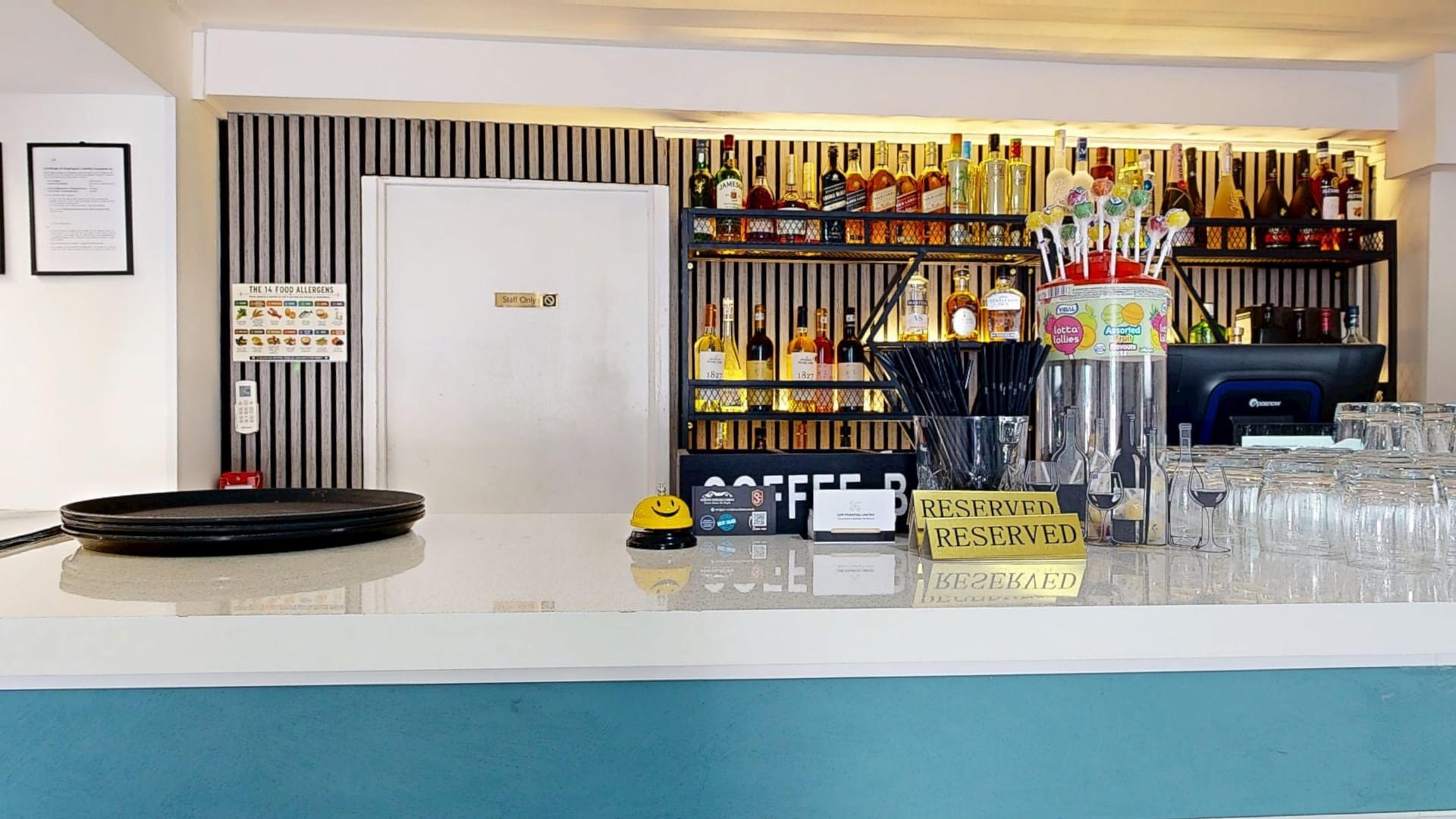 The spirits shelf behind the bar at Restaurant Acasă